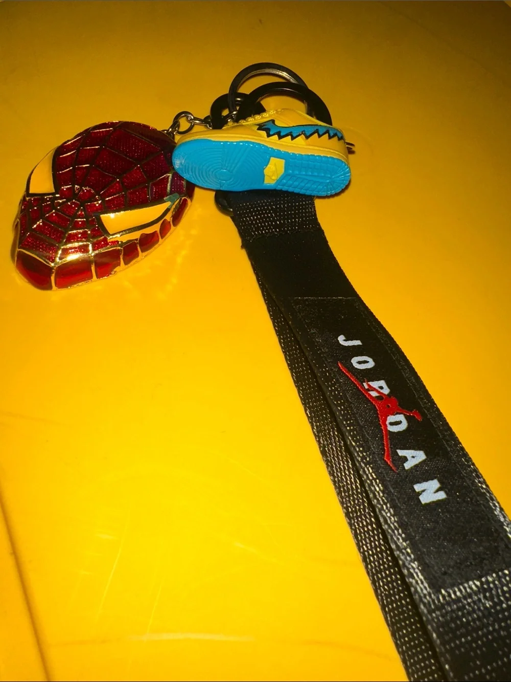 Jordan Kids Black Lanyard with Yellow jordSneaker Charm and Red Spider man Badge
